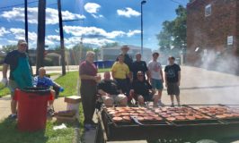 Flipping burgers at the Catholic Action Center